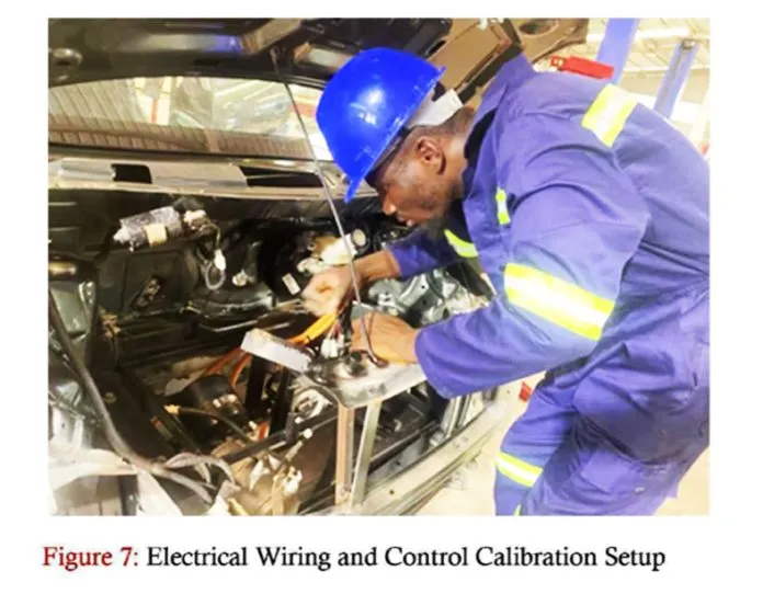 A KsTU student works on electrical wiring and calibration of the KsTU REV prototype.