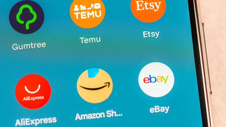 Several e-commerce app icons on a phone screen