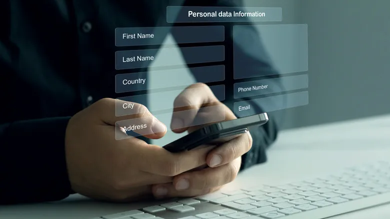 A person filling out their personal data on their phone